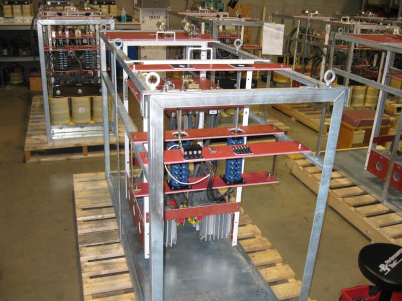 Photograph of 500-amp cathodic protection rectifiers in various stages of construction